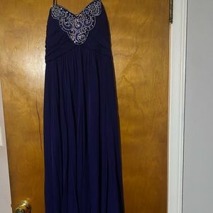 Long strapless navy blue prom dress.